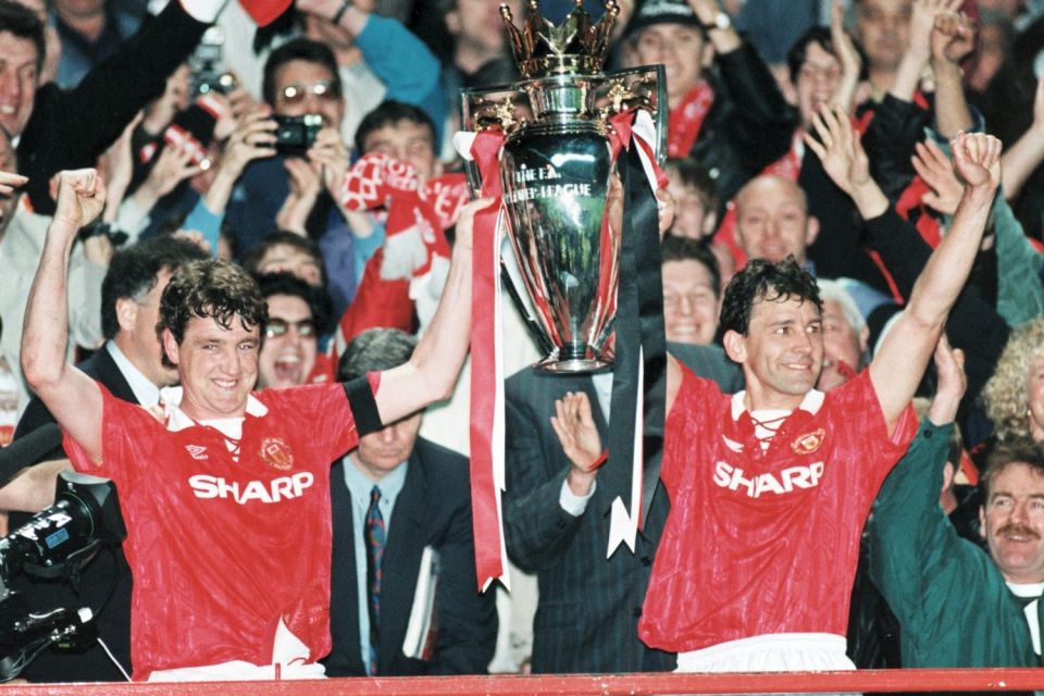 Steve Bruce and Bryan Robson celebrate ending 26 years of hurt as Manchester United win the title