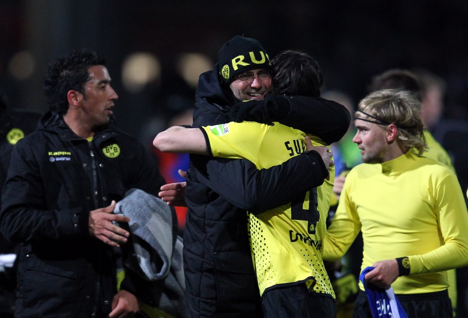 KIEL, GERMANY - FEBRUARY 07: Juergen Klopp (L), head coach of Dortmund celebrate with Neven Subotic (R) after the DFB Cup Quarter Final match between Holstein Kiel and Borussia Dortmund at Holstein-Stadion on February 7, 2012 in Kiel, Germany. (Photo by Martin Rose/Bongarts/Getty Images)