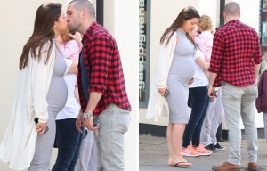 Coronation Street star Shayne Ward tenderly kisses pregnant girlfriend Sophie Austin