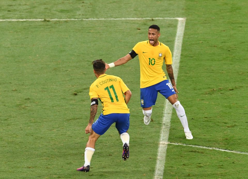 Coutinho celebrates with Neymar after giving Brazil the lead in Belo Horizonte