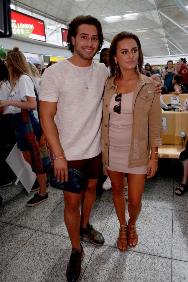 Love Island winners Kem and Amber stopped for a photo amid the scenes of excitement