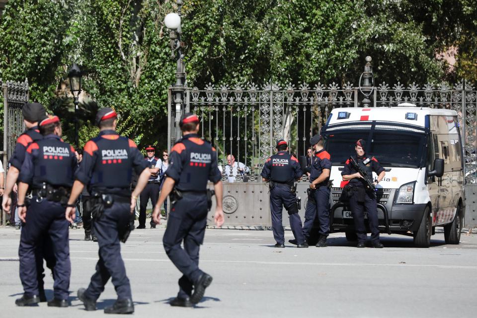 Catalan regional police officers, stand guard outside the Catalonian regional parliament in Barcelona