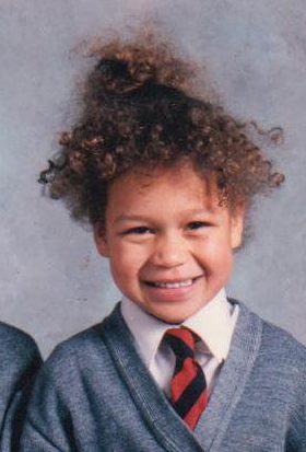  2. Who did this curly haired singer grow up to be?