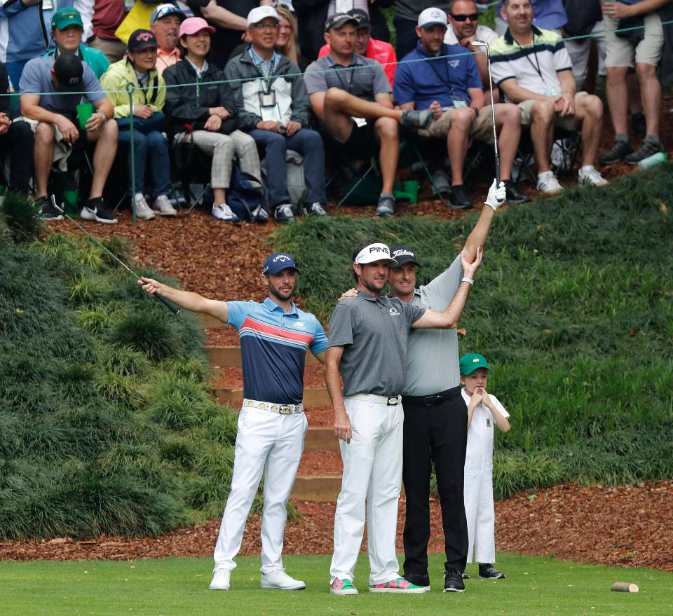 Wesley Bryan of the US, Bubba Watson of the US and Webb Simpson of the US react on the ninth hole during the Par 3 Contest