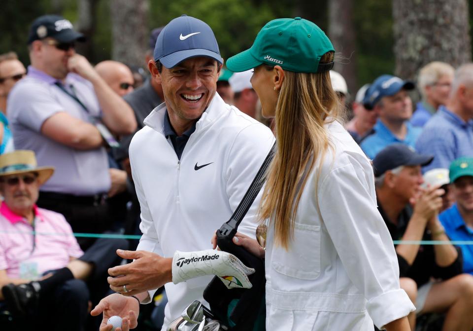 Rory McIlroy of Northern Ireland talks with his wife Erica Stoll