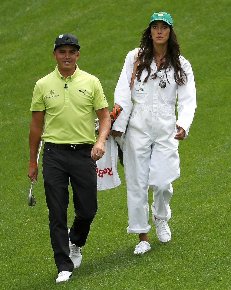 Rickie Fowler of the United States and girlfriend Allison Stokke walk together 