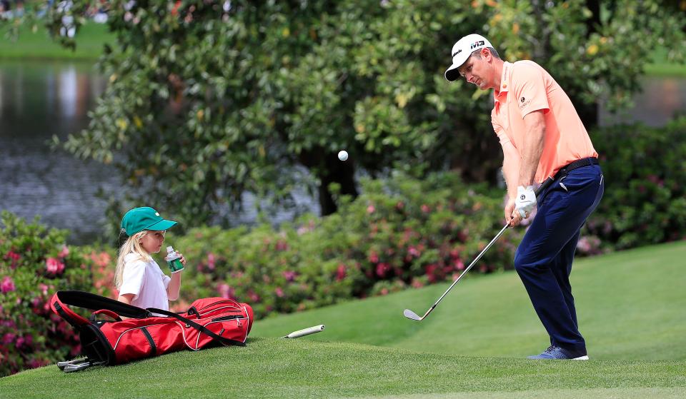 Justin Rose of England chips on the fifth hole 