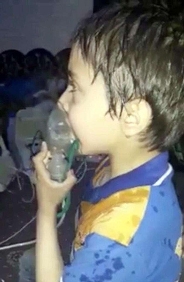 A toddler given oxygen through respirators following an alleged poison gas attack in the opposition-held town of Douma