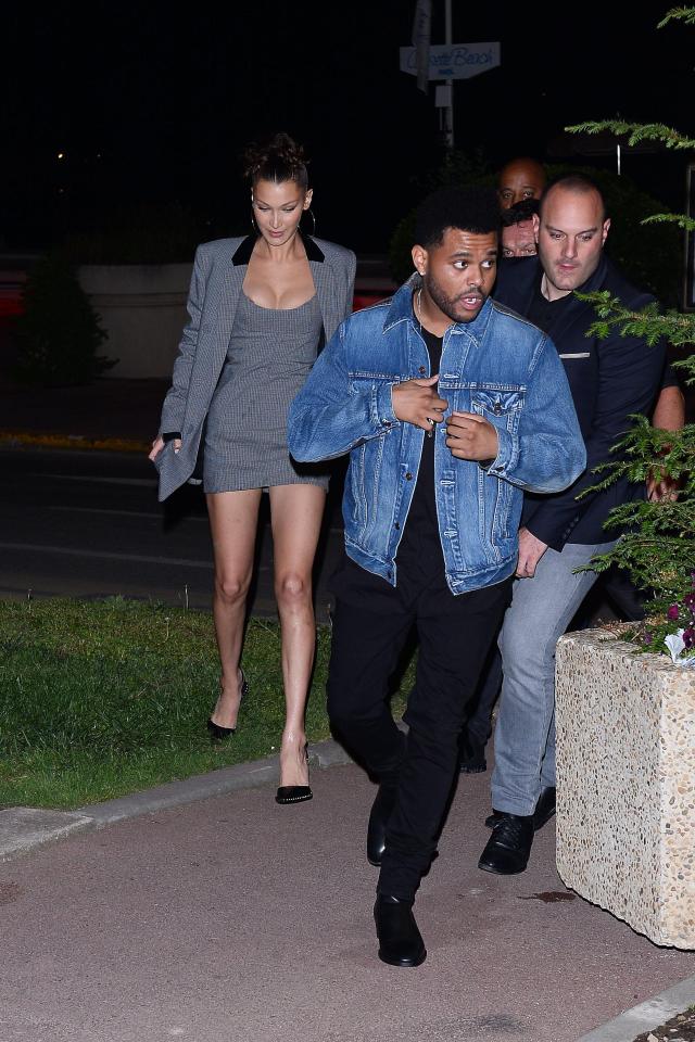  The Weeknd looked casual in a denim jacket as he walked ahead of Bella