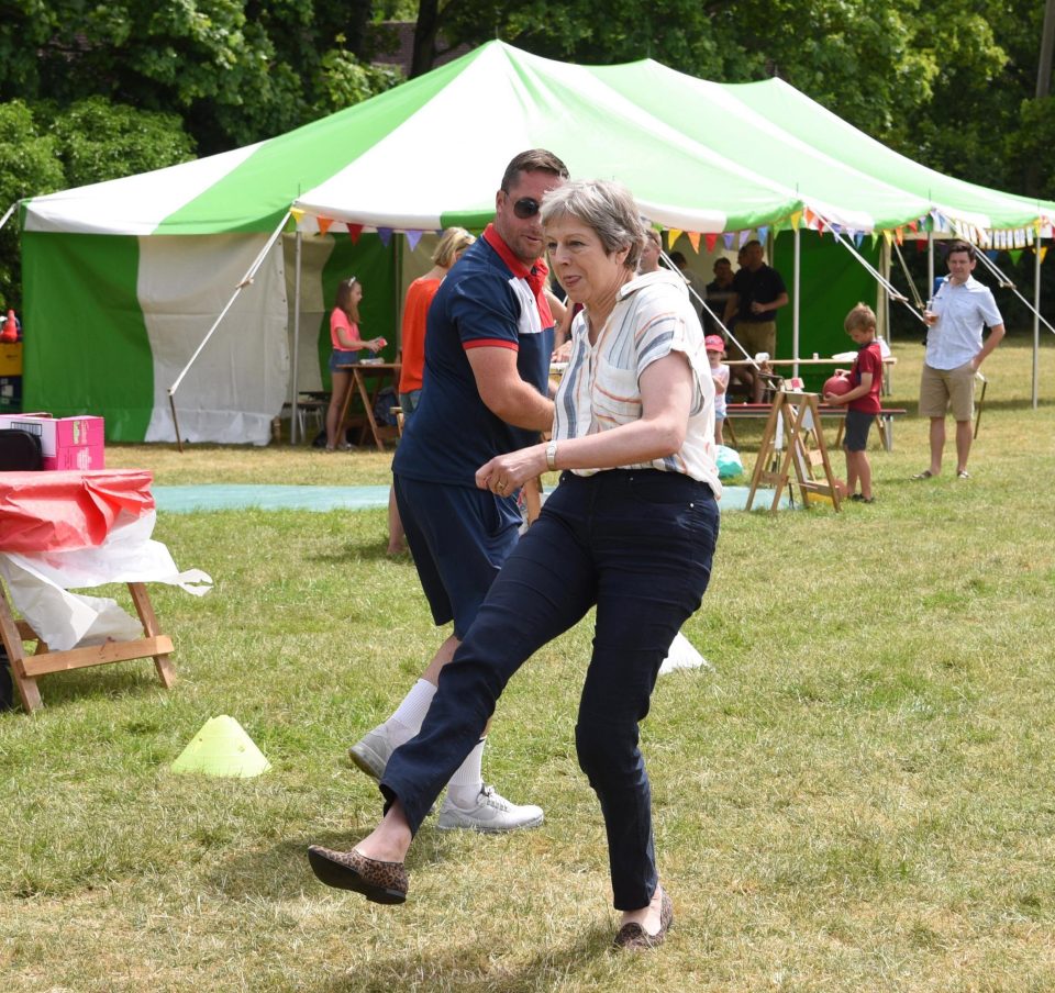  Mrs May opted for her trademark leopard-print loafers to have a go at the ‘Beat the Goalie’ competition at Cookham Dean Primary
