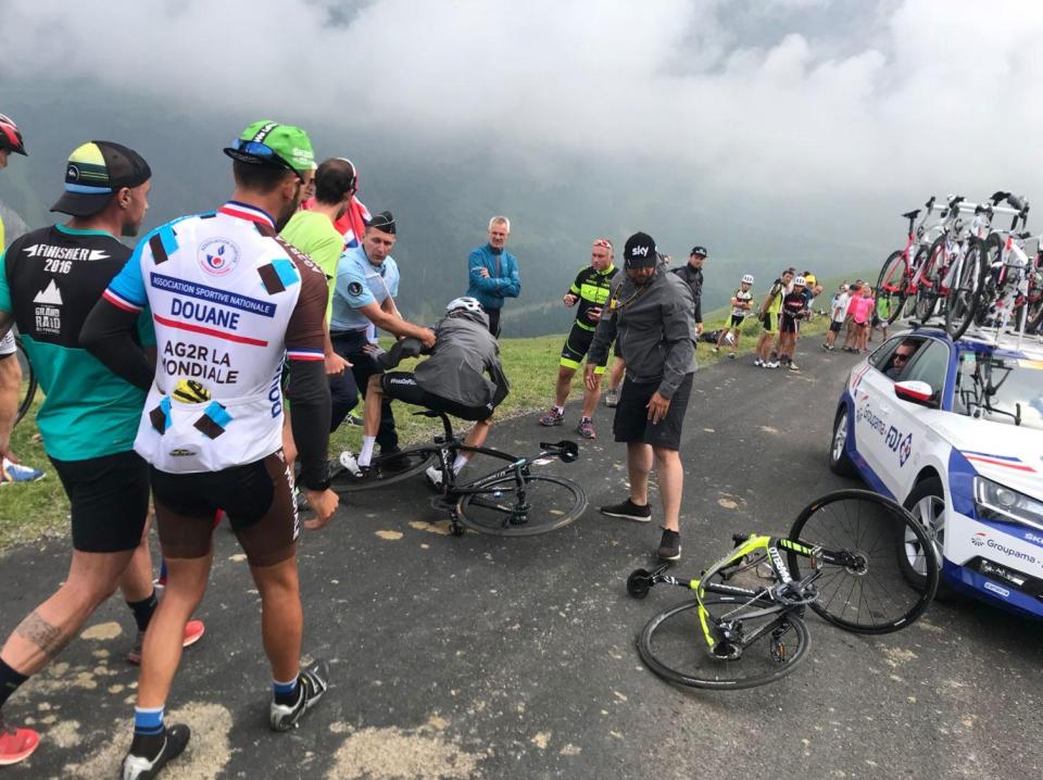  Chris Froome was knocked from his bike by the policeman