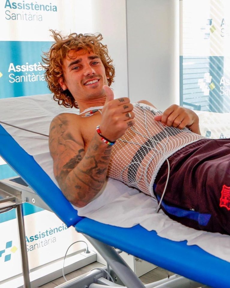 Antoine Griezmann looks delighted to finally be a Barca player as he does medical tests at their training ground