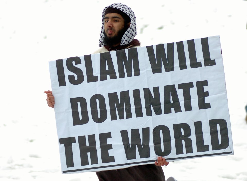  Khan displays a placard at a weekly rally held by Islamic extremists in Burslem, Staffs, in January 2010
