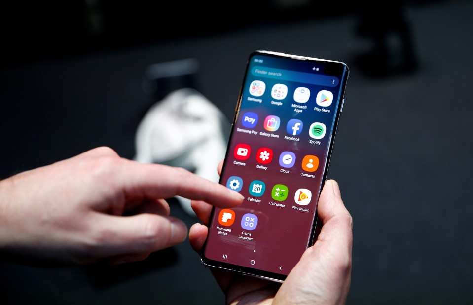 Person using a Samsung Galaxy S10 smartphone.