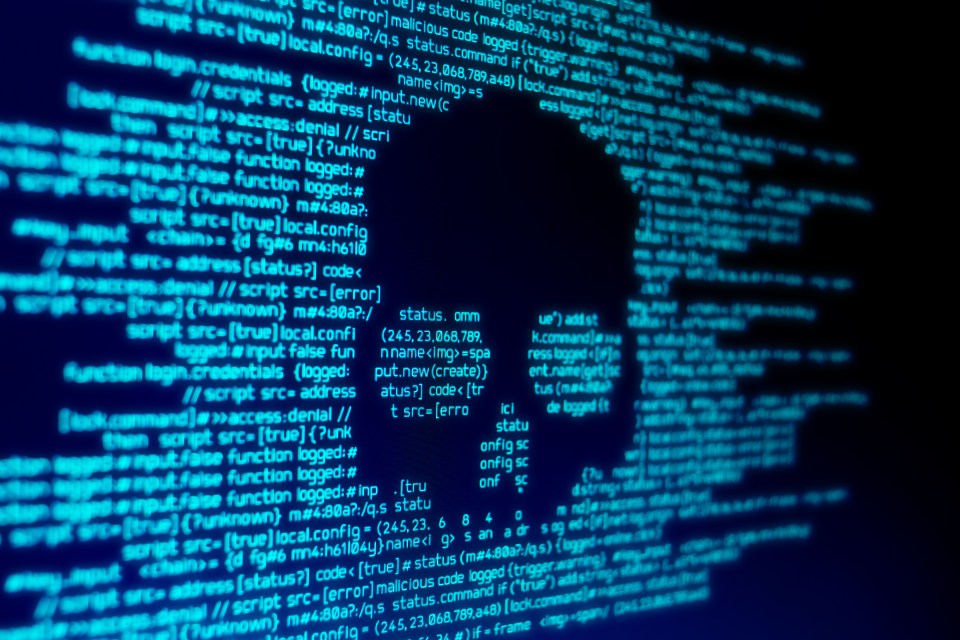 Computer screen displaying malicious code during a malware attack.