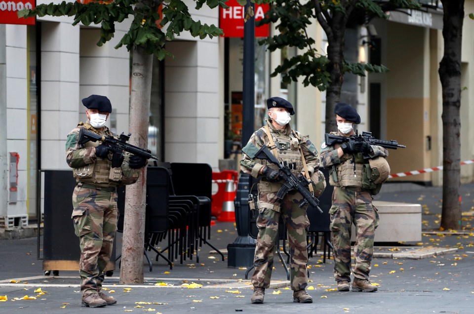 Special forces stand guard near the scene of a reported knife attack at Notre Dame