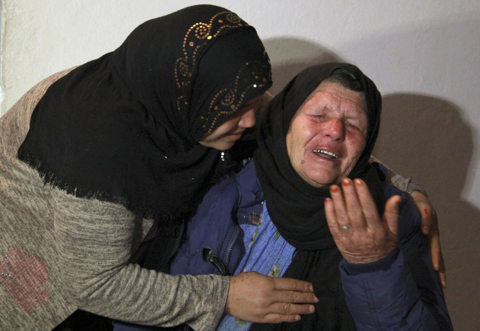 Kmar (R), mother of Nice assailant Brahim Aoussaoui cries at her home in Tunisia