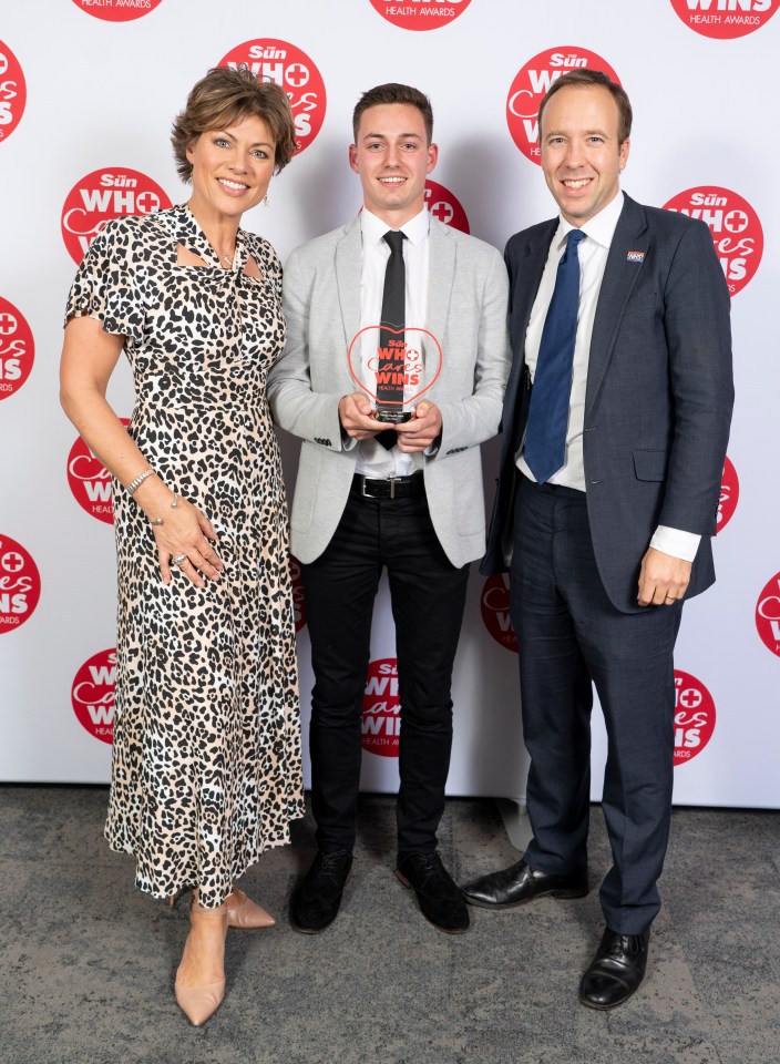 Award ceremony photo of Ben West receiving a Mental Health Hero award from Kate Silverton and Matt Hancock.