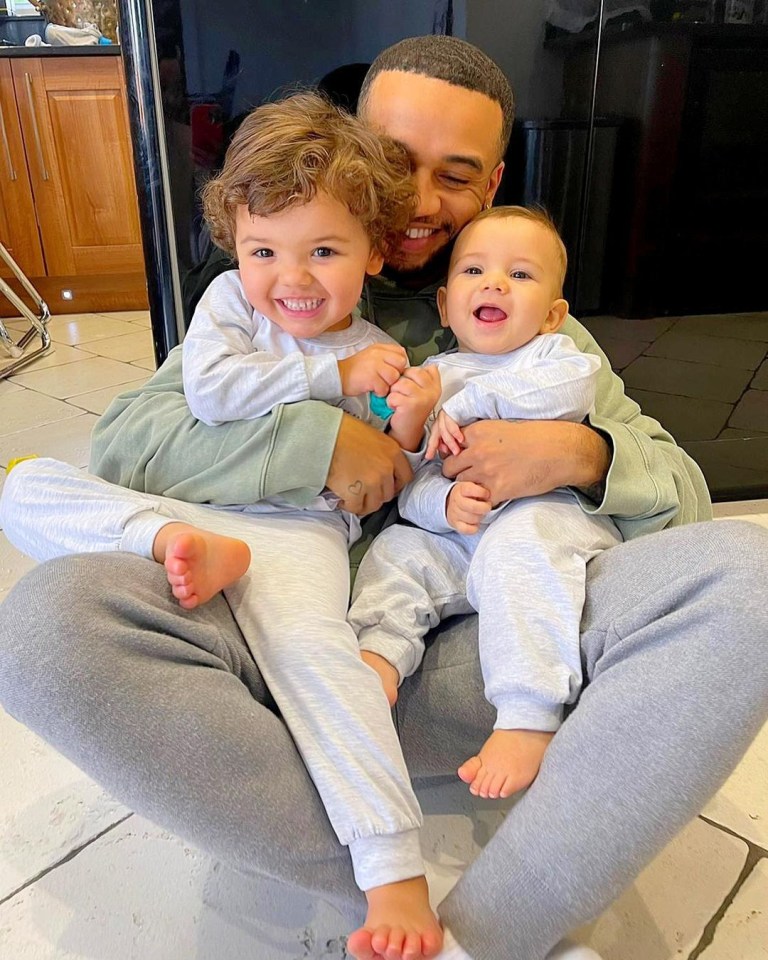 Aston with his sons Grayson, three, and Macaulay, 10 months