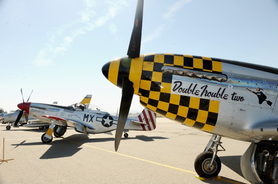Two fighter planes at an airshow.