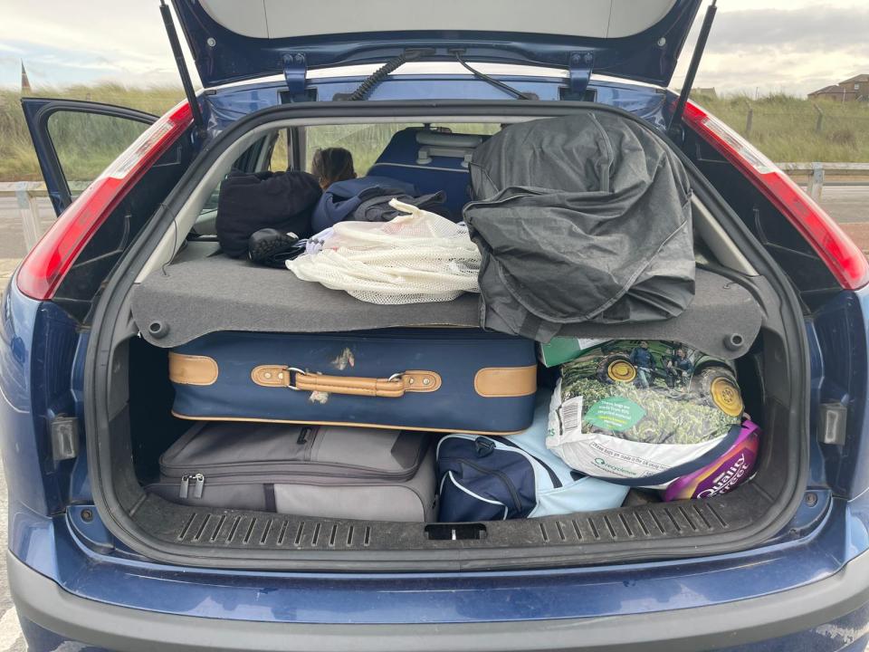 The couple's car is crammed with their belongings