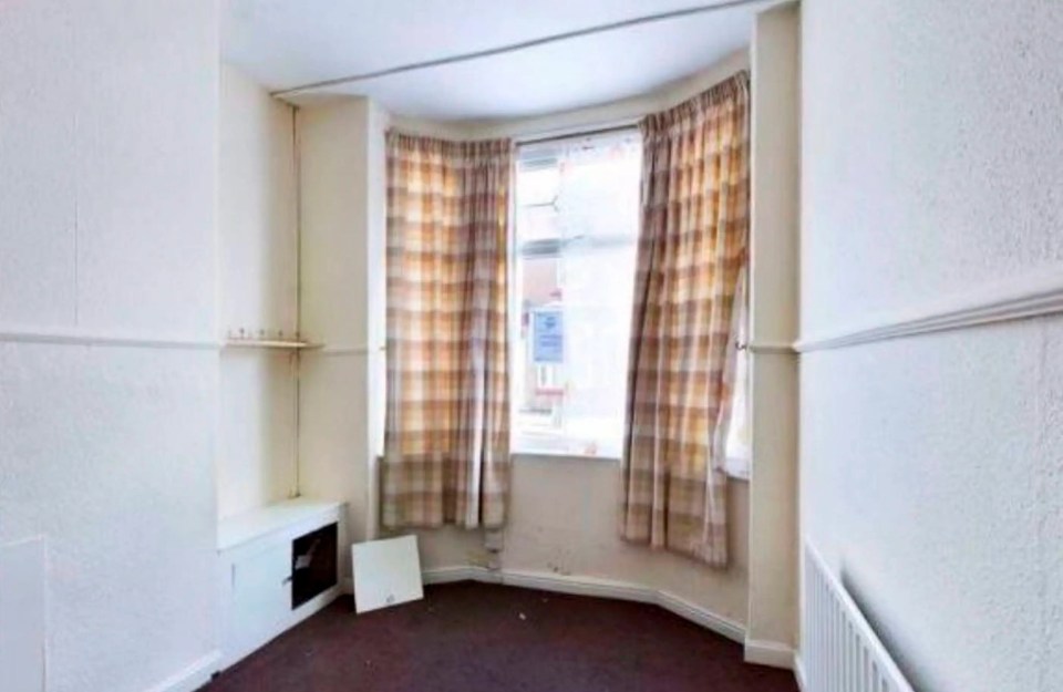 The property has a kitchen that leads to the rear garden
