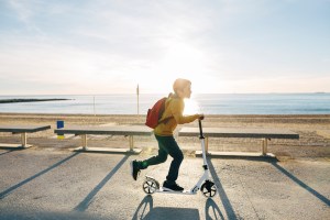 boy riding scooter