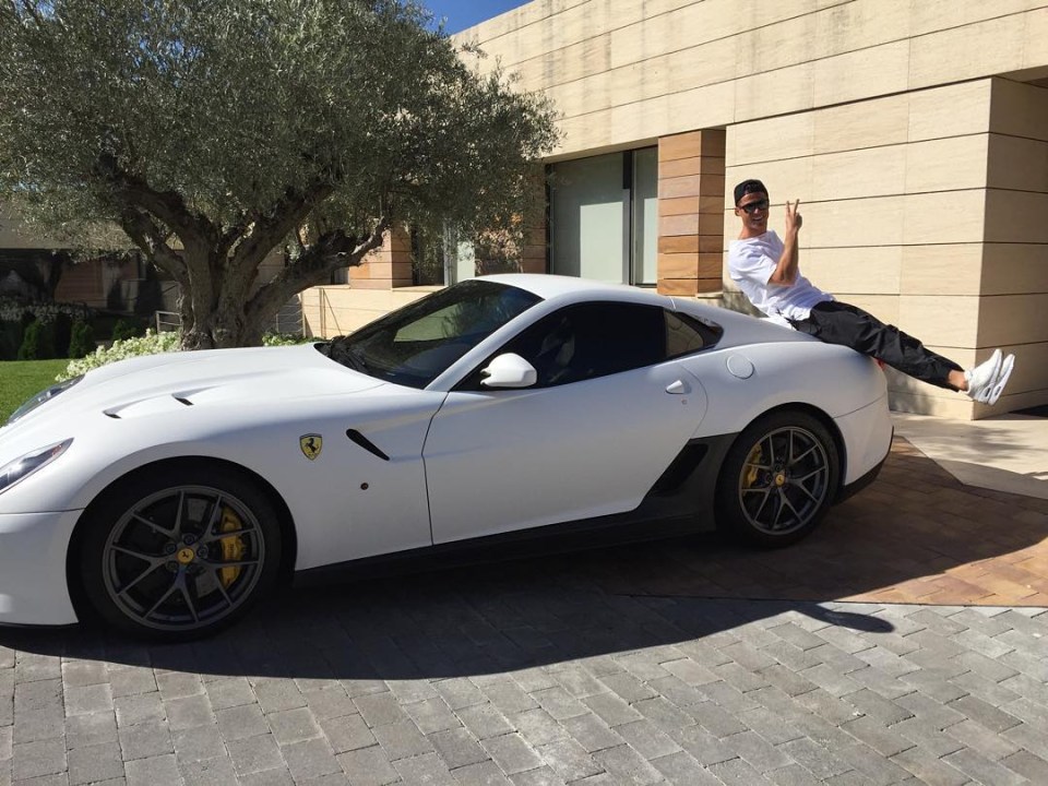 The Portuguese poses with a stunning Ferrari