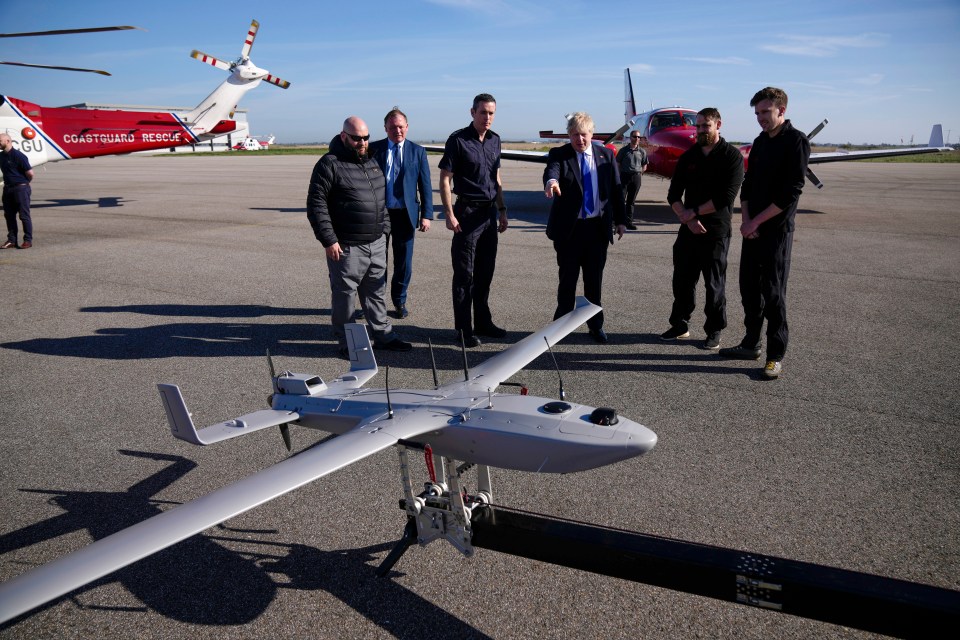 Boris Johnson looks at the surveillance drone at Lydd Airport