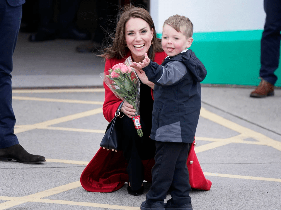 The princess poses for a picture with the youngster