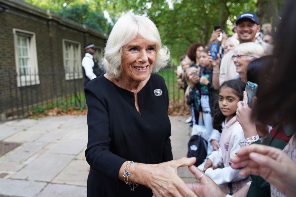 The Queen greeted members of the public outside Clarence House, London