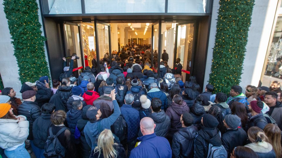 Retailers celebrated as shoppers defied predictions and hit the stores in droves - pictured Brits rushing for Selfridges in London