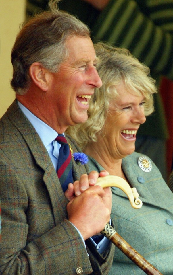 Prince Charles and Camilla Parker Bowles laughing together.