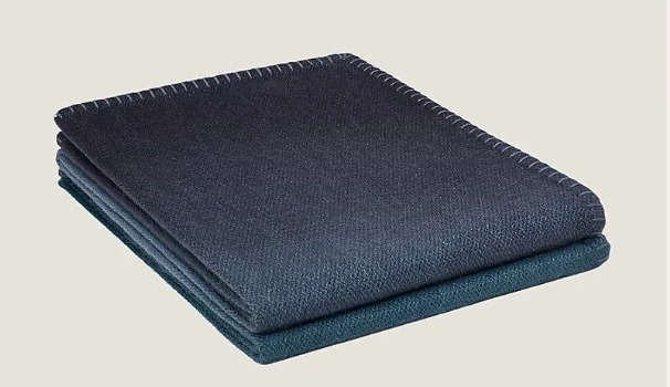 £2,440: On global trips her ‘comforter’ is her blue Hermes fringed blanket