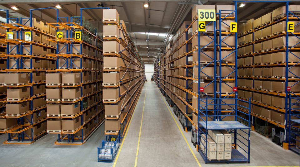 a warehouse filled with lots of boxes and a sign that says 300