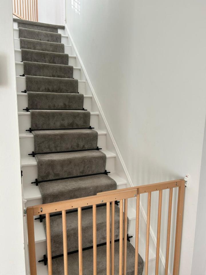 She watched YouTube videos and did a stair runner with her leftover carpet