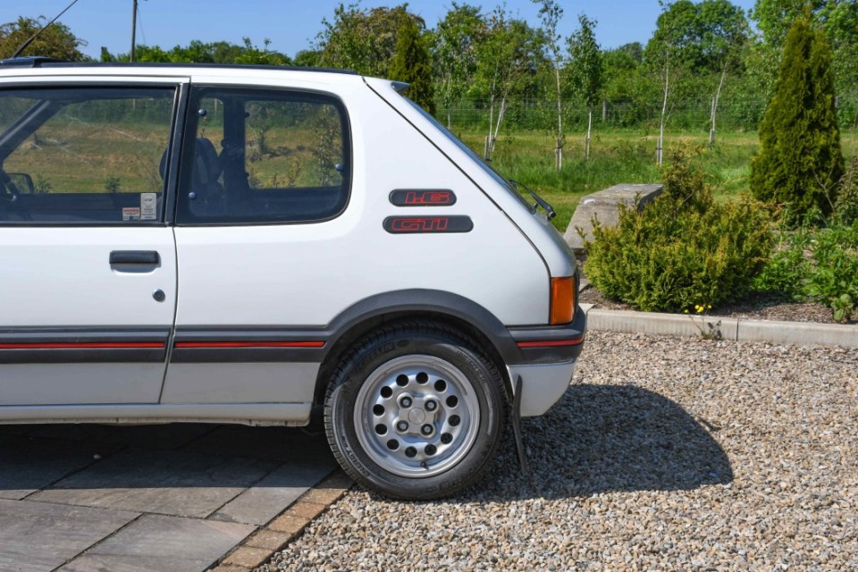 The Peugeot owned by James Herriot between his retirement in 1990 and his death five years later. It sold for £22,000 at auction TRIANGLE NEWS 0208 629 3622 // news@trianglenews.co.uk By Emily Hall Pics A VINTAGE Peugeot 205 once owned by the writer and vet who inspired the BBC telly show All Creatures Great and Small has sold for £22,000 at auction. The white 1990 Peugeot 205 GTI once belonged to Alf Wight OBE, better known by his pen name of James Herriot. Alf was a British veterinary surgeon who practised in the Yorkshire Dales for almost 50 years. *TRIANGLE NEWS DOES NOT CLAIM ANY COPYRIGHT OR LICENCE IN THE ATTACHED MATERIAL. ANY DOWNLOADING FEES CHARGED BY TRIANGLE NEWS ARE FOR TRIANGLE NEWS SERVICES ONLY, AND DO NOT, NOR ARE THEY INTENDED TO, CONVEY TO THE USER ANY COPYRIGHT OR LICENSE IN THE MATERIAL. BY PUBLISHING THIS MATERIAL , THE USER EXPRESSLY AGREES TO INDEMNIFY AND TO HOLD TRIANGLE NEWS HARMLESS FROM ANY CLAIMS, DEMANDS, OR CAUSES OF ACTION ARISING OUT OF OR CONNECTED IN ANY WAY WITH USER'S PUBLICATION OF THE MATERIAL*