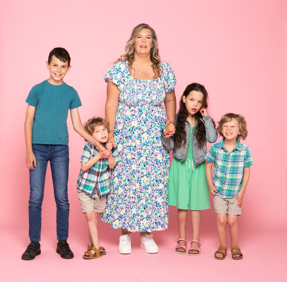 Mother and her four children posing together.