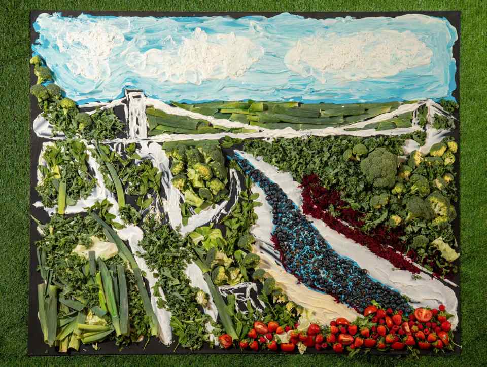 *** FREE FOR EDITORIAL USE ***.Yeo Valley Organic partners with food artist Nathan Wyburn to recreate iconic UK landscape Avon Gorge and Clifton Suspension Bridge in Bristol, made from organic British produce including plump strawberries, succulent raspberries, earthy beetroot, crispy leeks, and Yeo Valley Organic Natural Yogurt.