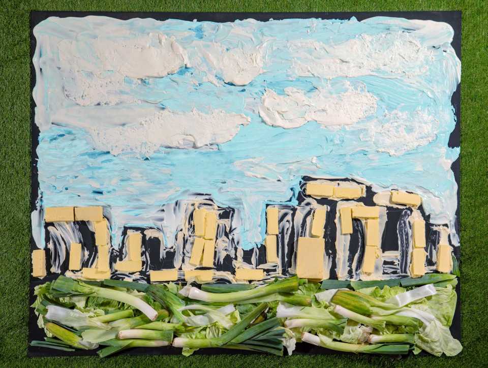 *** FREE FOR EDITORIAL USE ***.Yeo Valley Organic partners with food artist Nathan Wyburn to recreate the iconic UK landscape Stonehenge in Wiltshire, made from blocks of Yeo Valley Organics Mature Cheddar Cheese, swirls of Natural and Kefir Yogurt and decorated with vibrant organic leeks and hearty cabbage leaves.