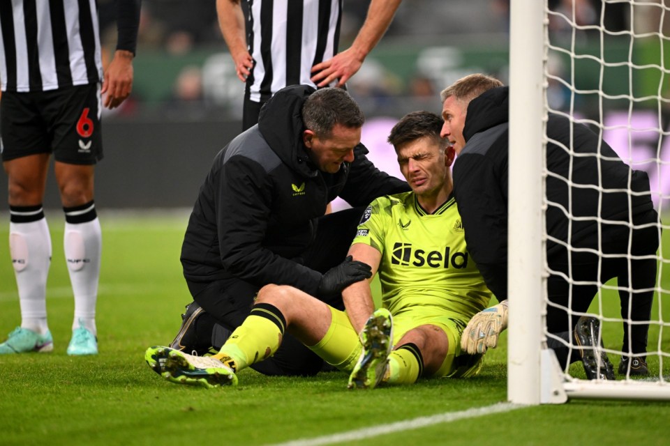 NEWCASTLE UPON TYNE, ENGLAND - DECEMBER 02: Nick Pope of Newcastle United receives medical treatment after suffering with an injury during the Premier League match between Newcastle United and Manchester United at St. James Park on December 02, 2023 in Newcastle upon Tyne, England. (Photo by Stu Forster/Getty Images)