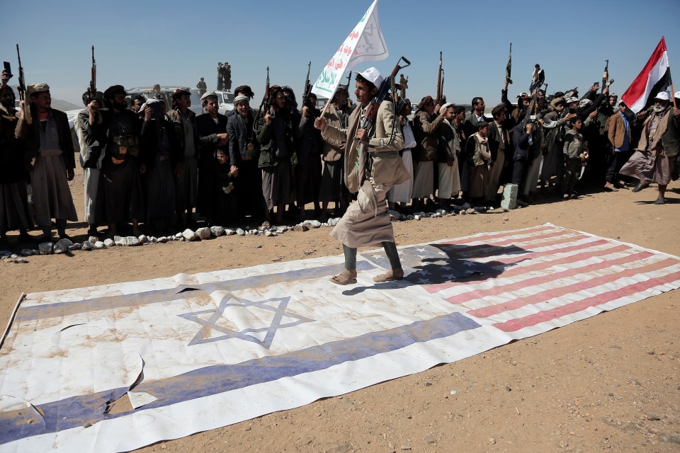Yemen's Houthi followers take part in a tribal parade held against the aerial attacks on Monday
