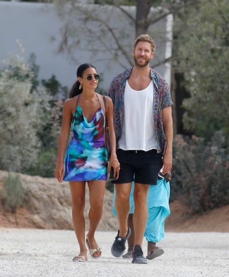 Calvin Harris and Vick Hope walking together.