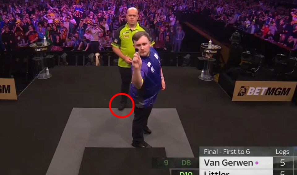 Michael Van Gerwen was stood inside the 'exclusion zone' as Luke Littler was at the oche