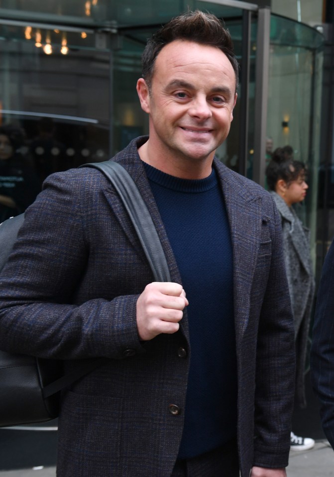 The dad-to-be looked stylish as he headed to work