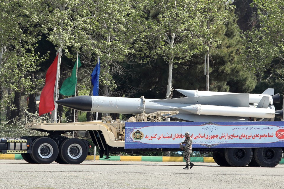 An Iranian military truck carries missiles during a military parade as part of a ceremony marking the country's annual army day in the capital Tehran on April 17, 2024. (Photo by ATTA KENARE / AFP) (Photo by ATTA KENARE/AFP via Getty Images)