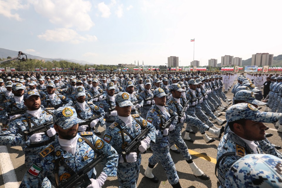 Iranian soldiers march in formation