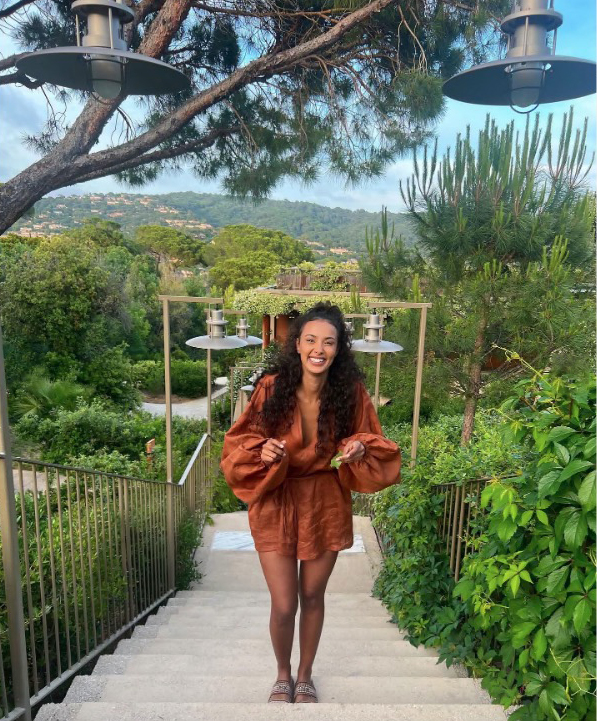 Maya beamed in a bronze mini dress on one evening at the resort