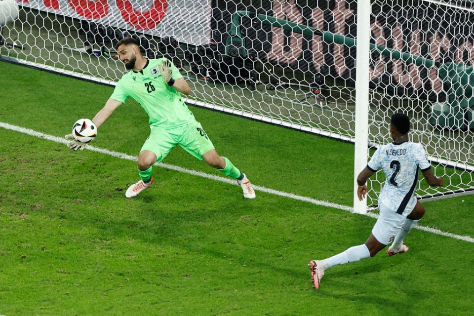 TOPSHOT - Portugal's defender #02 Nelson Semedo misses an attempt to score against Georgia's goalkeeper #25 Giorgi Mamardashvili during the UEFA Euro 2024 Group F football match between Georgia and Portugal at the Arena AufSchalke in Gelsenkirchen on June 26, 2024. (Photo by KENZO TRIBOUILLARD / AFP) (Photo by KENZO TRIBOUILLARD/AFP via Getty Images)