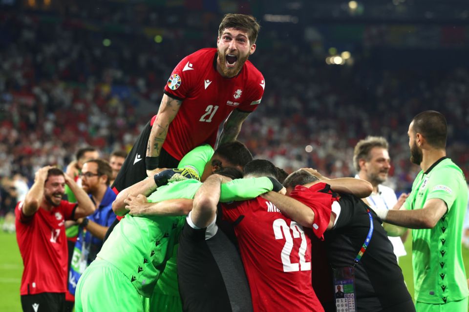 GELSENKIRCHEN, GERMANY - JUNE 26:  Georgiy Tsitaishvili of Georgia celebrates with his team-mates at the end of the UEFA EURO 2024 group stage match between Georgia and Portugal at Arena AufSchalke on June 26, 2024 in Gelsenkirchen, Germany.(Photo by Chris Brunskill/Fantasista/Getty Images)